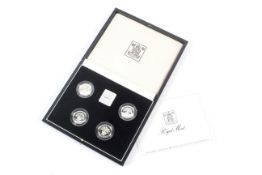 Four 1984-1987 £1 Piedfort silver proof coins in a box