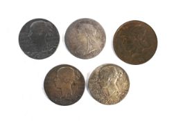 Four small silver Diamond Jubilee medallions.