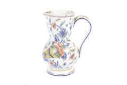 A French faience Rouen-style jug, circa 1900.