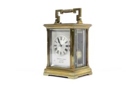 A Hamilton & Inches (Edinburgh and Paris Made) brass carriage clock.