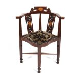 An Edwardian mahogany marquetry inlaid corner chair.