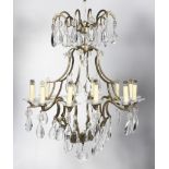A Labadie chandelier with two tiers issuing 12 lights, retailed by Vaughan Lighting.