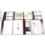 Four boxed albums of stamps of Royal events and world war, etc.
