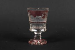 A 19th century Bohemian flashed and engraved hunting goblet.