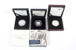 Three Royal Mint silver proof coins.