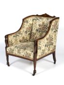 A late 19th century rosewood and marquetry inlaid armchair.