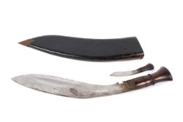 A vintage Nepalese Kukri knife and leather sheath.