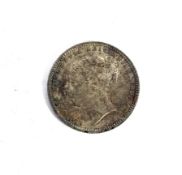 An 1880 shilling coin