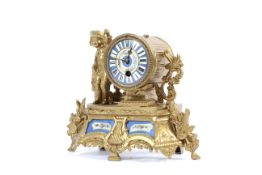 A gilt-metal and porcelain mounted mantel clock, circa 1900.