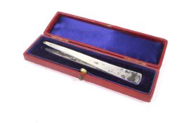 A pair of silver stamp tweezers. Hallmarked London, makers marks rubbed, in a fitted red box, 12.