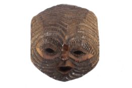 An early 20th century carved hardwood Tribal Art mask.