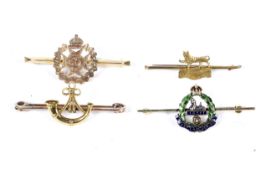 Four gold and yellow metal sweetheart brooches.