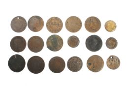 A small group of engraved coins and tokens