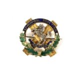 A yellow metal The King's Liverpool Scottish military brooch.