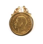 A George V gold half sovereign. Dated 1916, within a yellow metal mount marked '9ct',