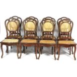 A set of eight contemporary caned dinning chairs.