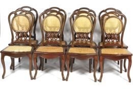 A set of eight contemporary caned dinning chairs.