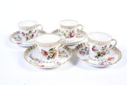 Four 20th century Dresden porcelain spiral-moulded tea cups and saucers.