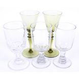 Five assorted vintage drinking glasses.