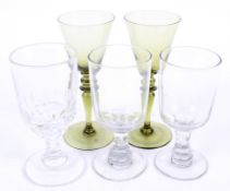 Five assorted vintage drinking glasses.