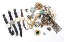 An assortment of costume jewellery and watches.
