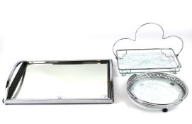 A vintage mirror tray and two glass and chrome cake stands.