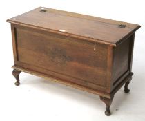 An early 20th century carved oak blanket box.