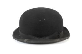 A vintage bowler hat signed by Acker Bilk.