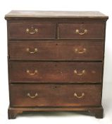A Victorian oak chest of drawers.