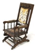 A 19th century mahogany rocking chair.