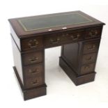 A 20th century mahogany kneehole desk.