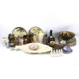 An assortment of studio pottery. Including a plate modelled as a fish, posy holders, plates, etc.