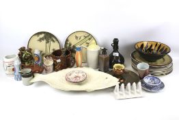 An assortment of studio pottery. Including a plate modelled as a fish, posy holders, plates, etc.
