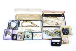 A collection of fifteen boxes of assorted costume jewellery.