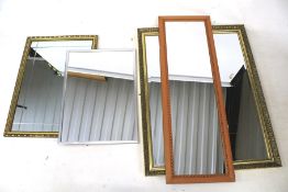 Four contemporary wall mirrors.