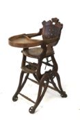 An antique child's high chair.