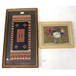 A 20th century framed section of woven tapestry and an oil on board.