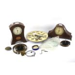 Three 20th century clocks and a selection of spares.