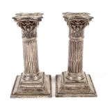 A pair of Victorian silver weighted candlesticks.