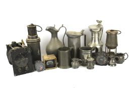 An assortment of metalware. Including pewter tankards, a miners lamp, steins, etc.