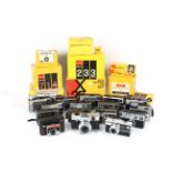 An extensive collection of Kodak Instamatic cameras within three boxes.