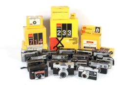 An extensive collection of Kodak Instamatic cameras within three boxes.
