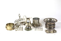 Assortment of silver plate and metalware. Including three toast racks and jug, etc.