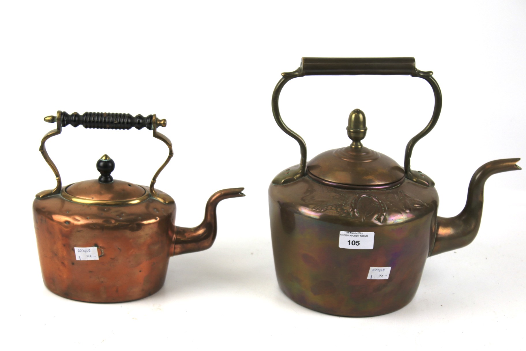 Two vintage copper kettles.