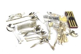 An assortment of silver plated and stainless steel flatware. Including knives, forks, spoons, etc.