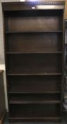 A stained mahogany freestanding open bookcase.