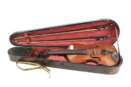 A vintage violin in a fitted wooden case. Violin L58.
