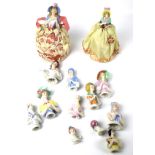 A collection of ceramic 'Pin Cushion' ladies.