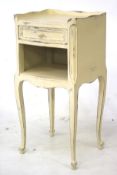 A French side table. Cream painted with drawer, ideal upcycling project. L32cm x H73cm W36cm.