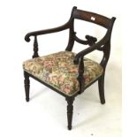 A Victorian mahogany carver open armchair.